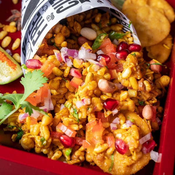 Bombay Street Food's Bhel Puri, a savory Indian snack with puffed rice, vegetables, and chutney.